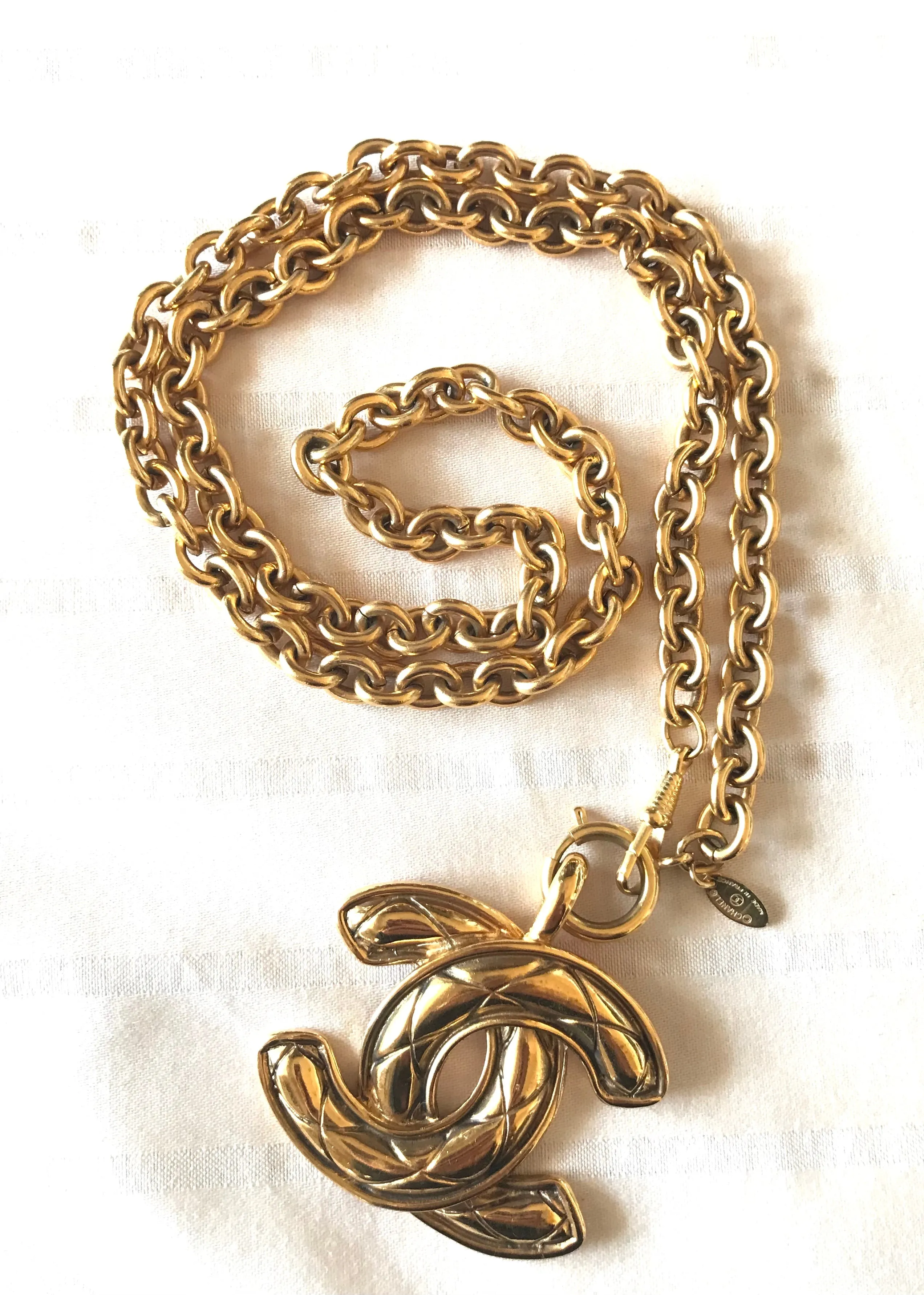 1990s. Vintage CHANEL long chain necklace with extra large matelasse CC mark pendant top.  Can be worn in double.  Gorgeous and classic jewelry piece.