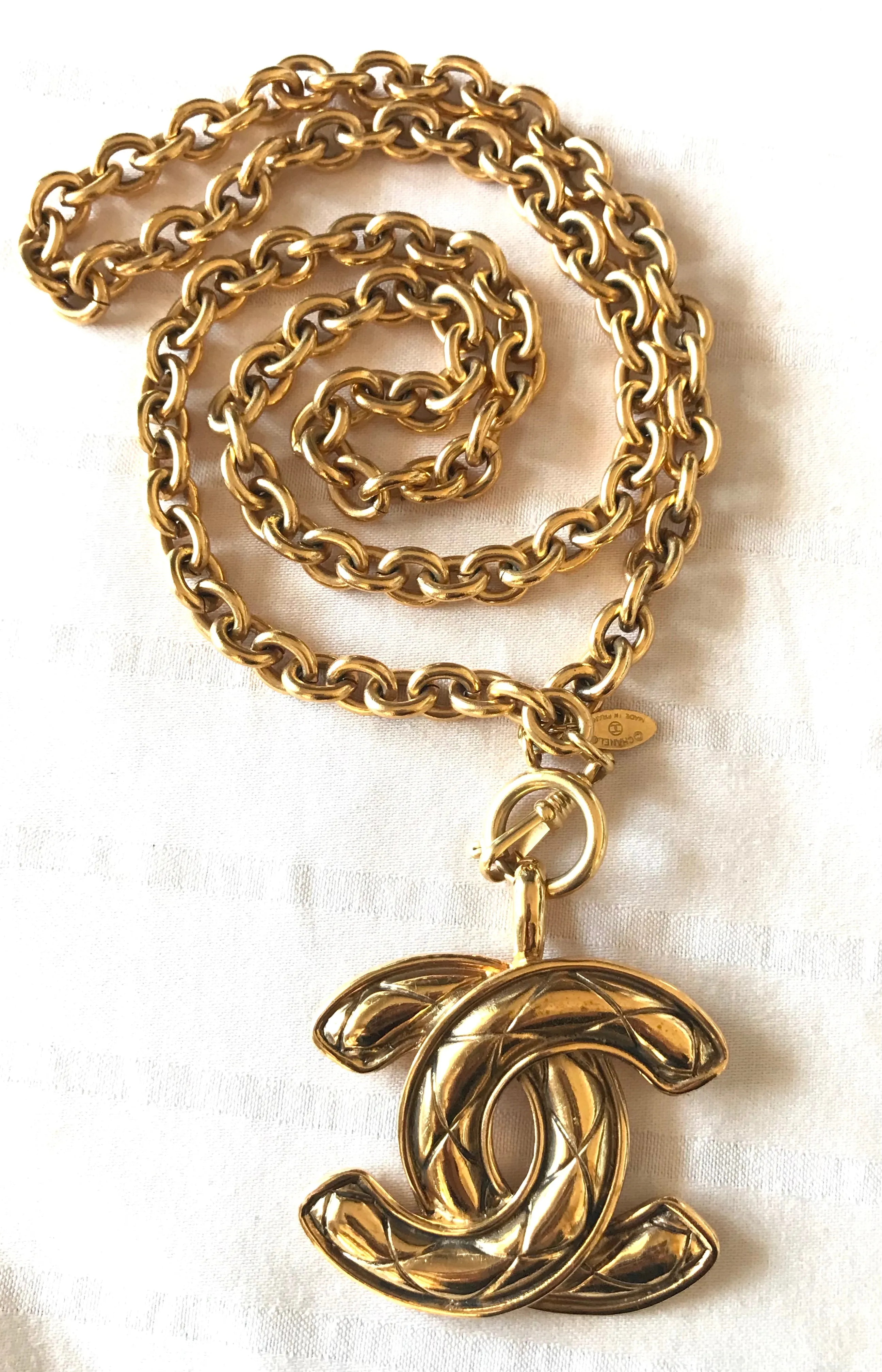 1990s. Vintage CHANEL long chain necklace with extra large matelasse CC mark pendant top.  Can be worn in double.  Gorgeous and classic jewelry piece.
