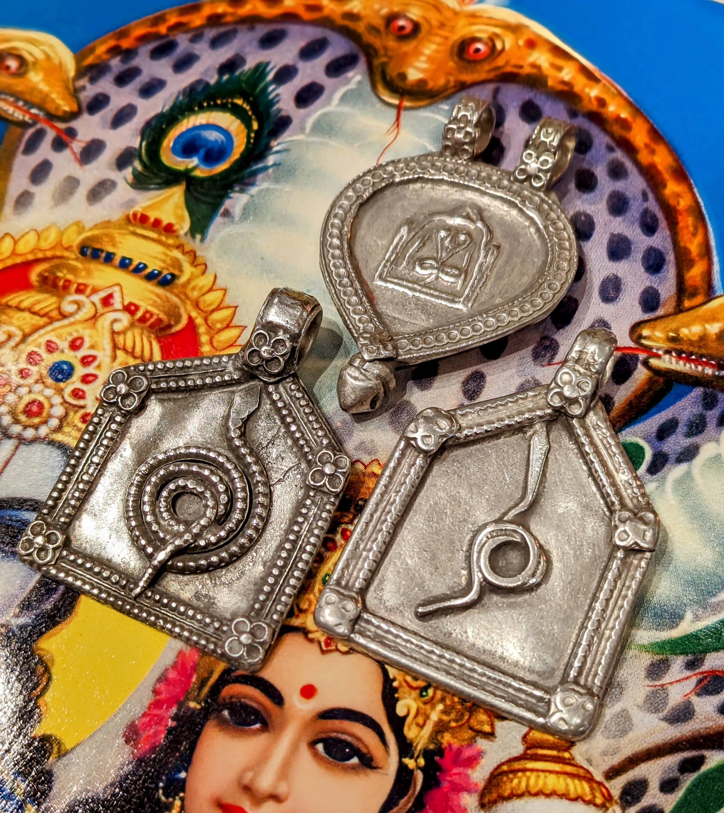 Antique silver serpent pendants