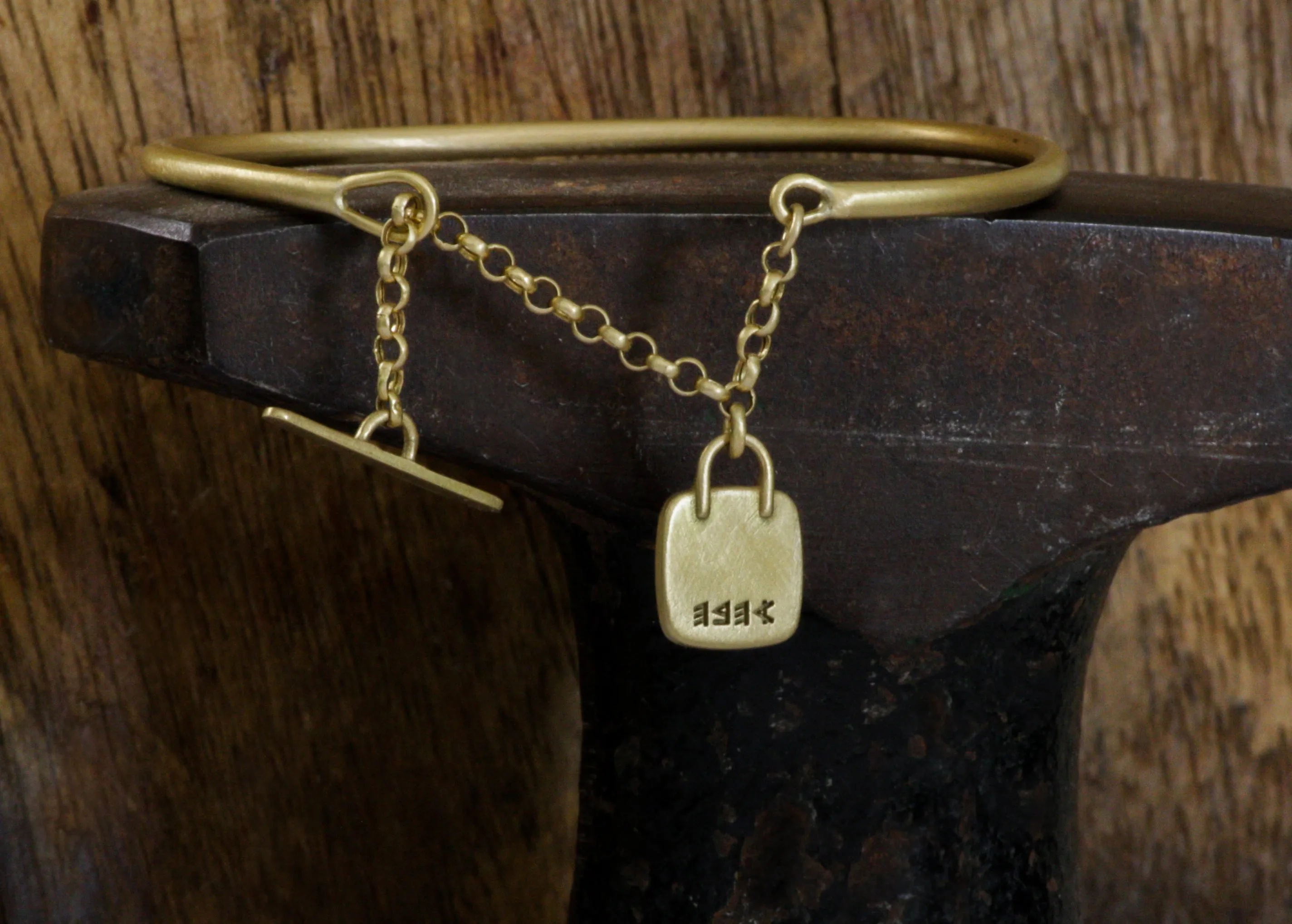 Gold filed Open cuff bracelet with closure chain & charm