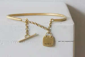 Gold filed Open cuff bracelet with closure chain & charm