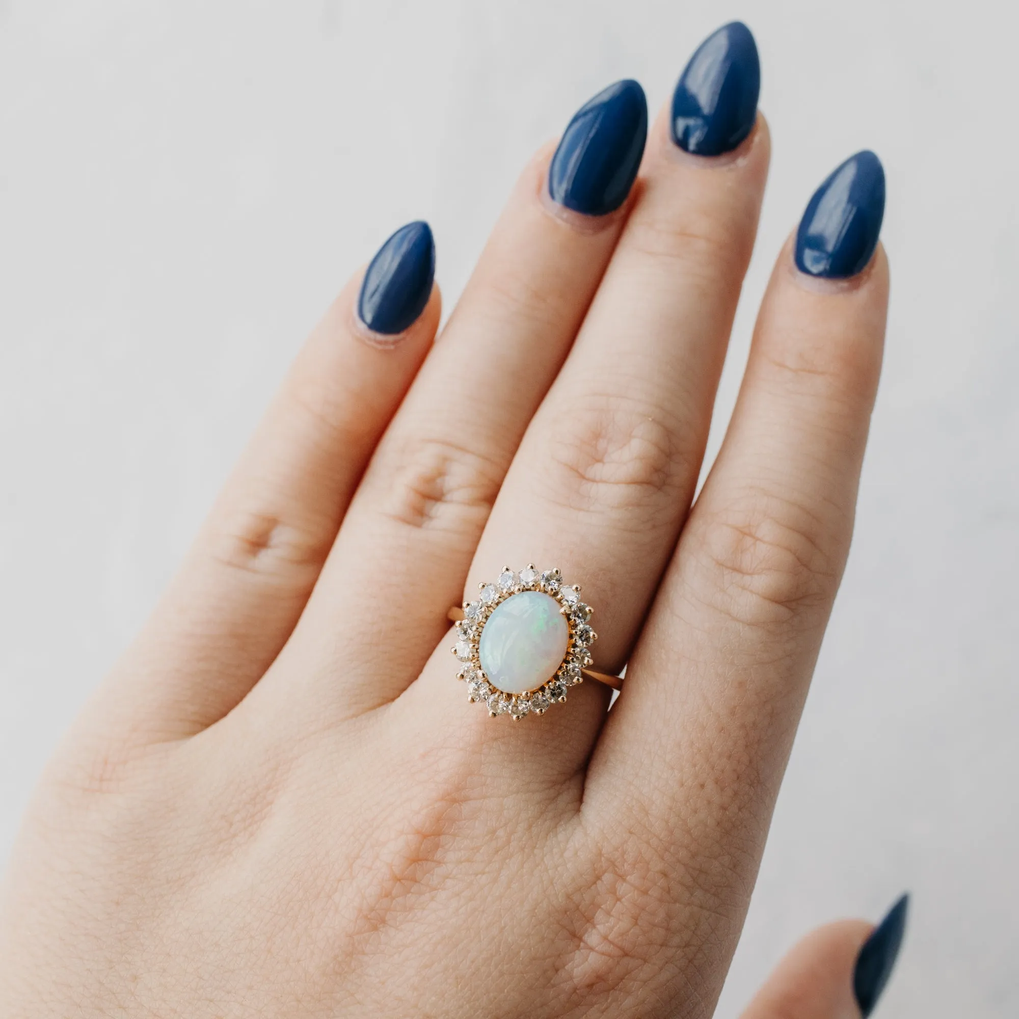 Oval Opal and Diamond Halo Ring