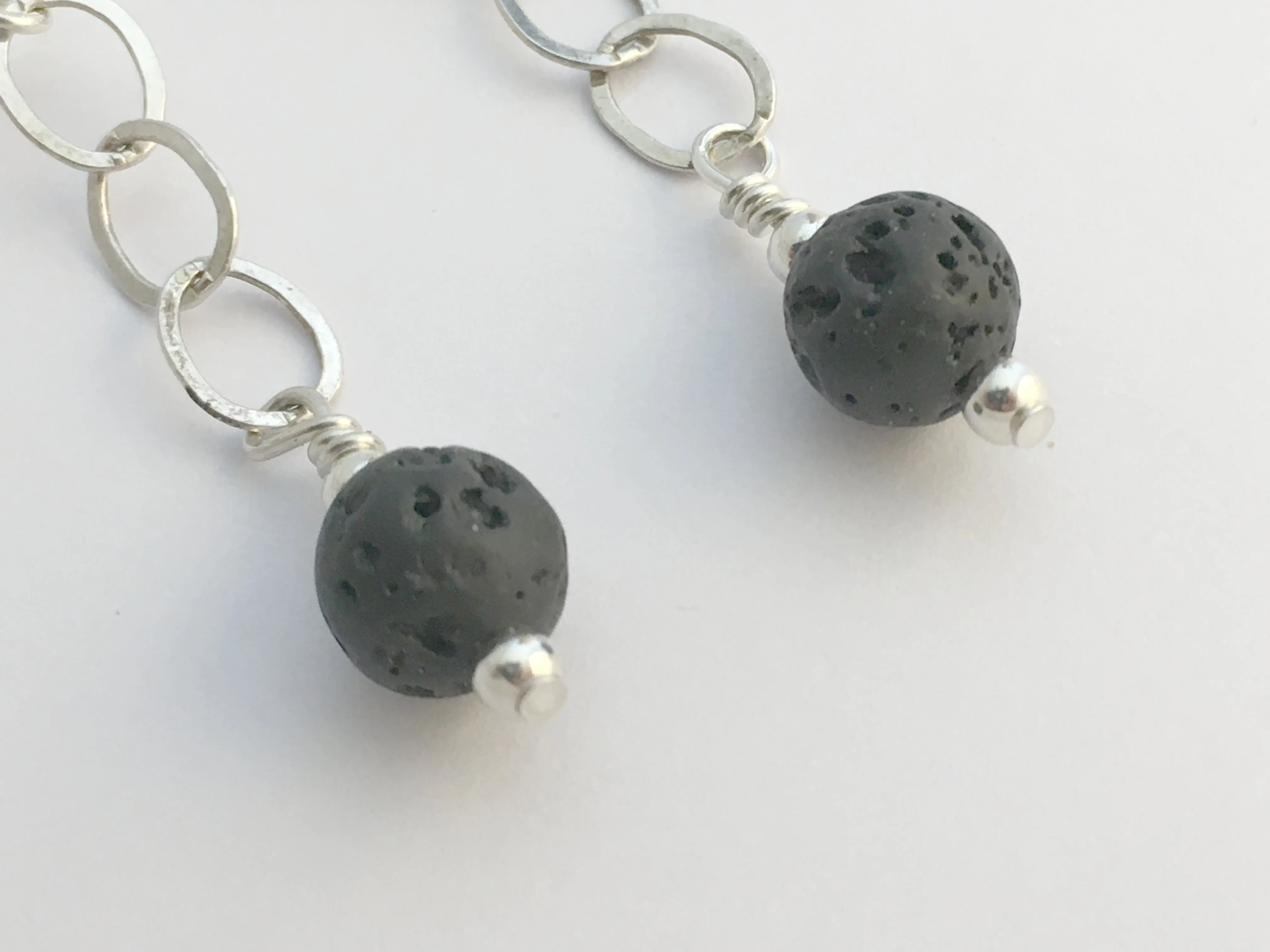 Sterling silver, Black Volcanic Scoria and Carved Quartz Crystal dangle earrings