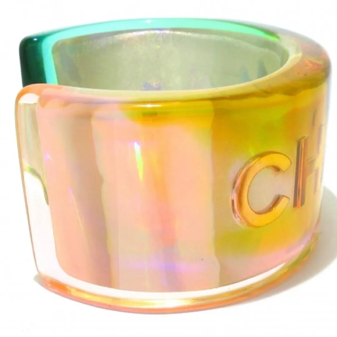 Vintage Chanel plastic aurora resin cuff link bangle/ bracelet with golden logo. Must have gorgeous jewelry. 060904br
